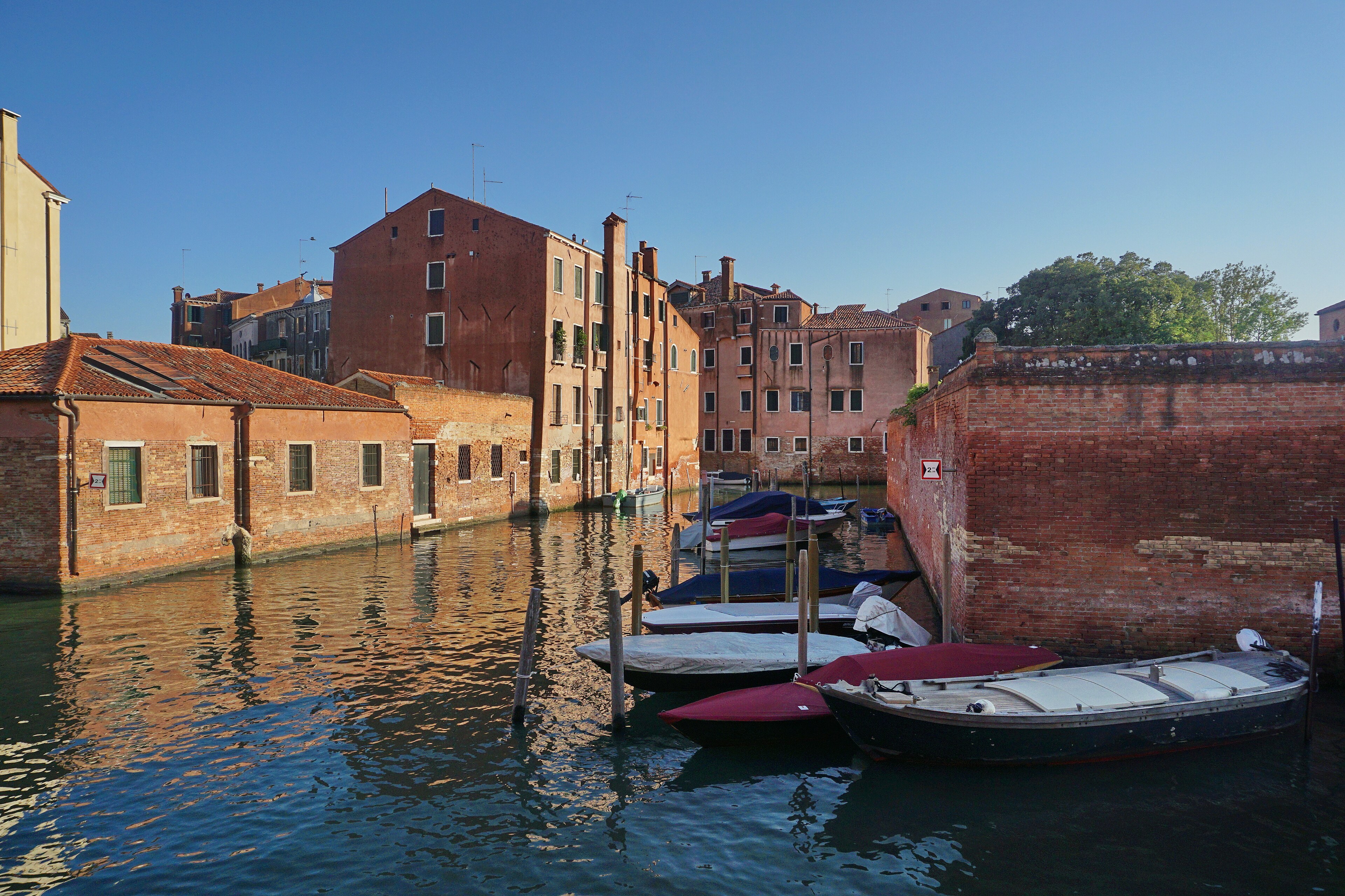 Rio del Battello in Cannaregio, a working canal with boats moored along the fondamenta
